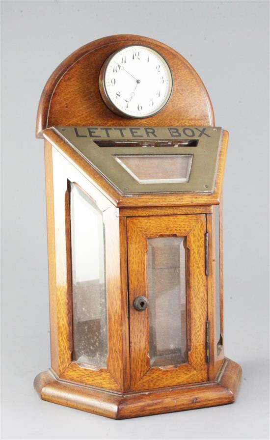 An Edwardian brass mounted golden oak and glass letter box, width 11in. height 18.5in.